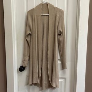 Cyrus brand tan cardigan. Medium thick